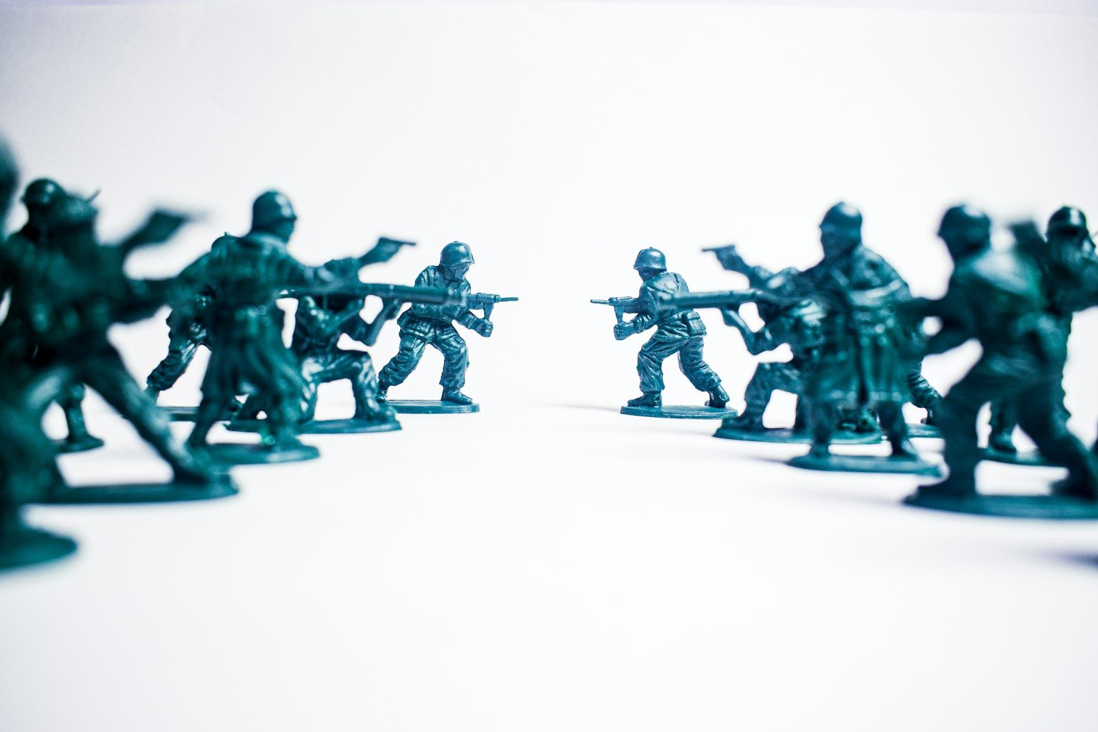 Green toy soldiers in a standoff